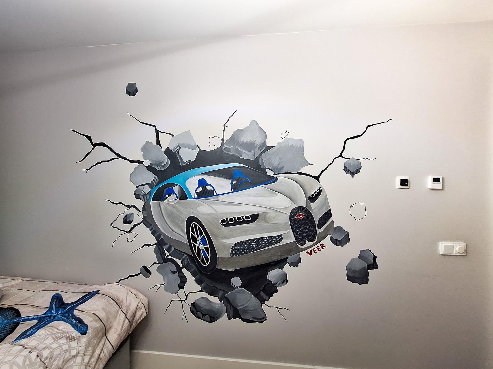 Jongenskamer met muurschildering auto